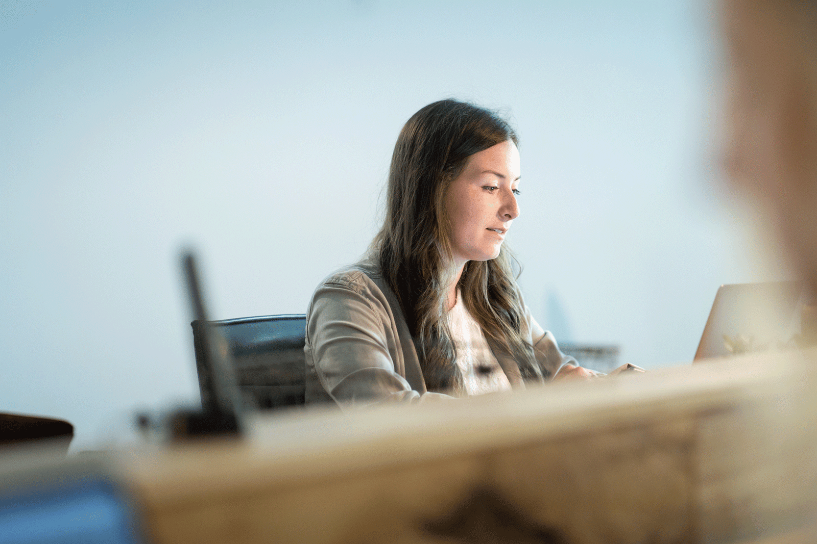 female sales team member working at desk to serve her customers